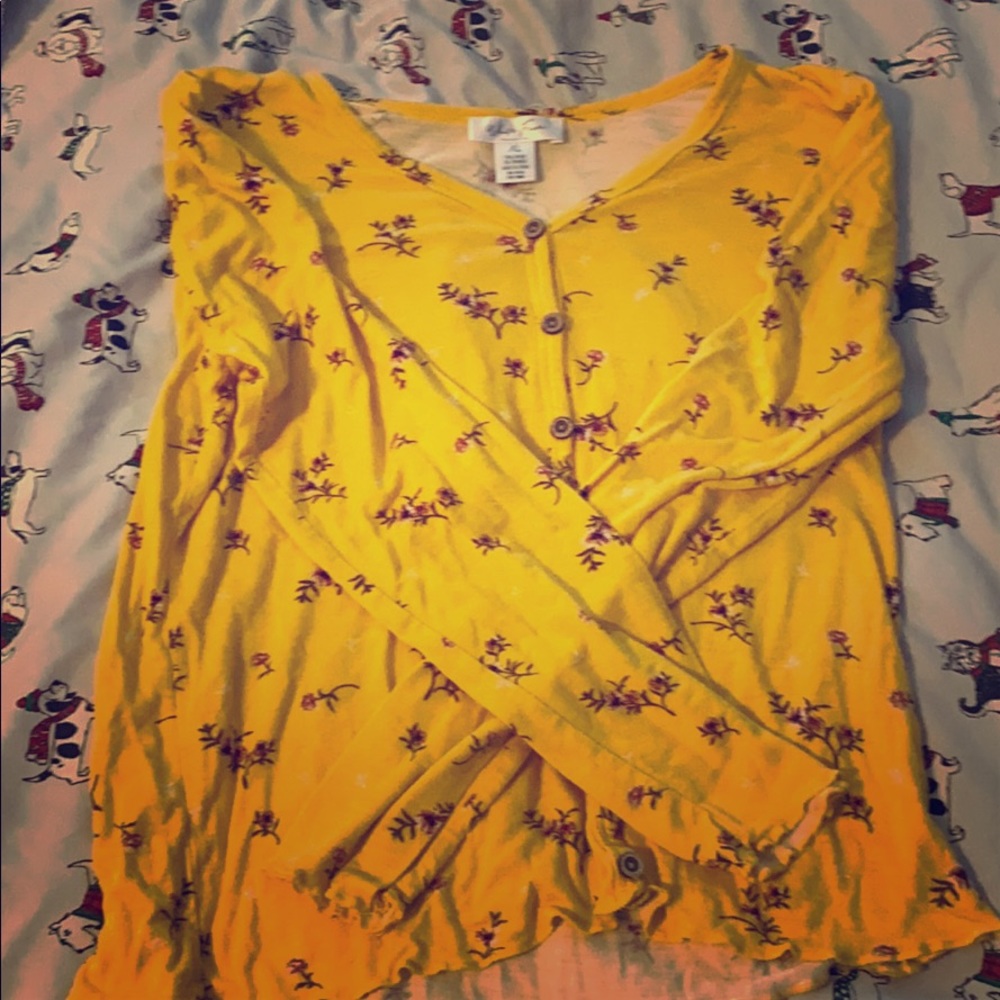 A Yellow long sleeve Shirt with red flowers